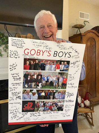 Goby90 goby at home holding his signed poster