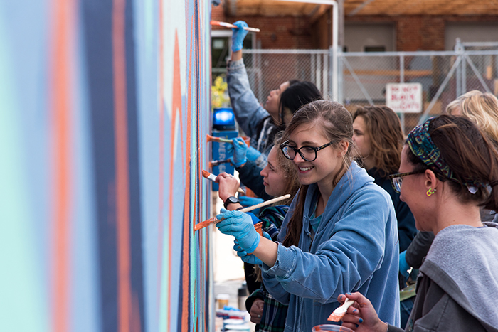 students create a mural at Goodyear Studios, on the Dickinson campus.