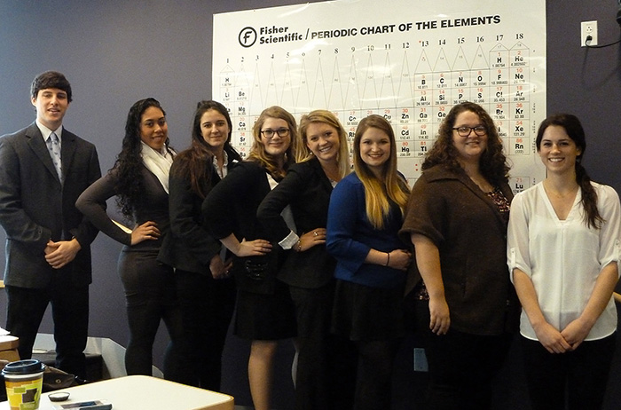 Students in a health-studies senior seminar pose for a group photo moments before delivering a public presentation of their research.