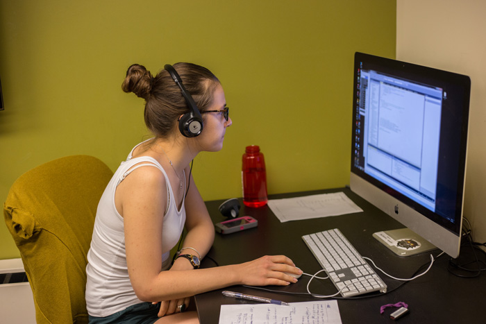 a student works at a computer on the game simulation.