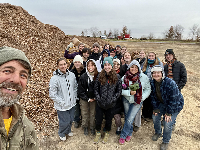 Students learn about the farm's renewable energy systems from Matt Steiman, energy projects manager (far left). Photo courtesy of the College Farm.