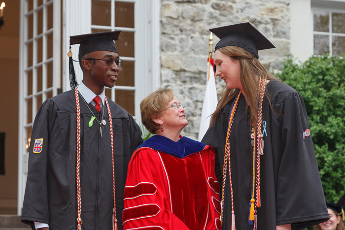 Hufstader Senior Prize winners Edward Brown (left) and Nastia Khlopina (right) pose with President Margee Ensign. Photo by Carl Socolow.