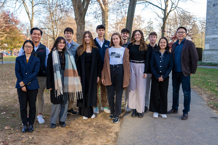 IB&M faculty pose with investment competition competitors