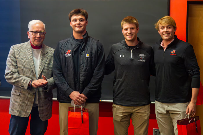 President Jones stands with the top three competitors