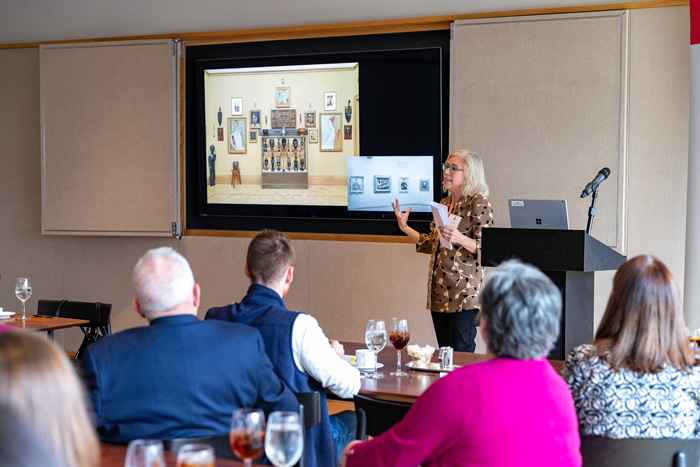 Associate Professor of Art History Elizabeth Lee  discusses works from the collection with participants. Photo by Carl Socolow '77.