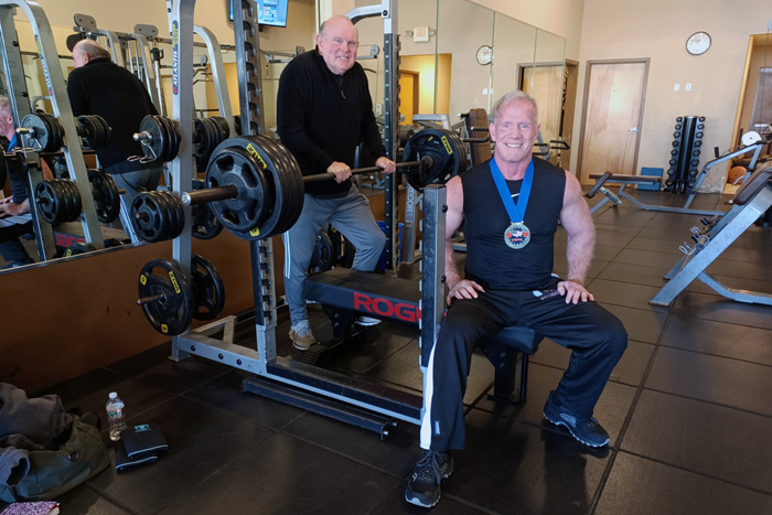 Jack Maley and his trainer in a gym