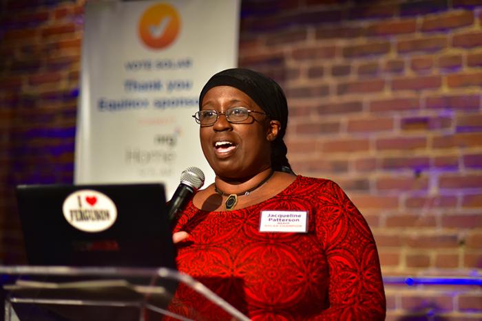 Photo of Jacqueline Patterson speaking at a podium.