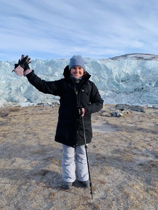 Jill standing in her trekking gear in Greenland 