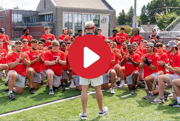 President Jones visits Dickinson football team.