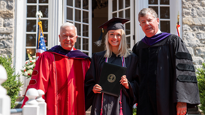 During last May's Commencement, Jordyn Nye '23 was honored as Dickinson's 13th Young Alumni Trustee. (From left:) President John E. Jones III '77, P'11; Nye; and Trustee John Frisch '80.