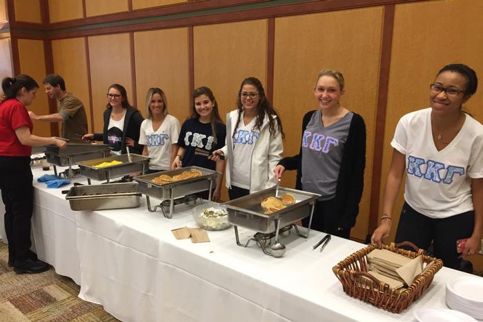 Kappa Kappa Gama members serve breakfast at the recent Pancake Breakfast.