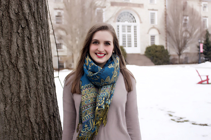 Katie Natoli poses in front of Old West on a temperate February day.