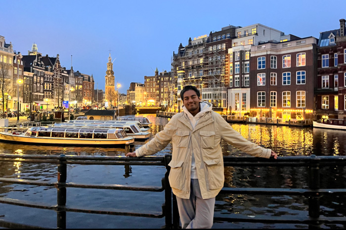 Kishan Mangru stands in front of a river