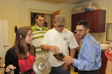 Picture of Ted Merwin with Students