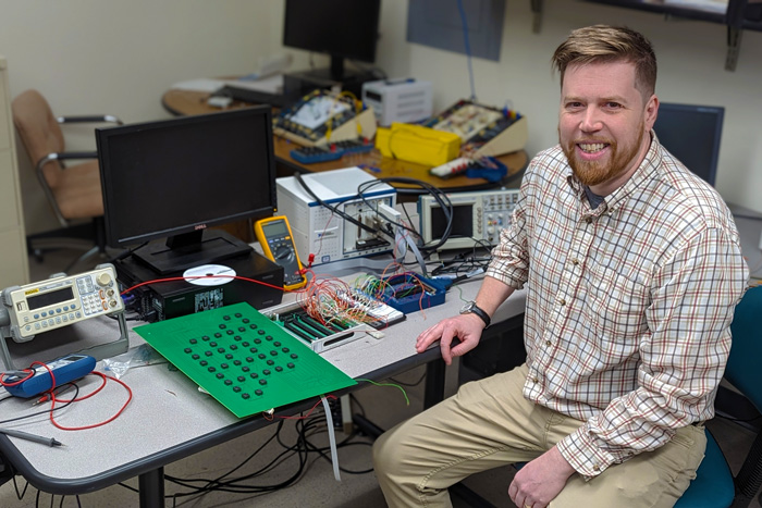 Lars English at his desk