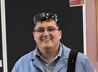 Prof Miguel Leal in a lab coat and glasses