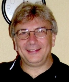 Headshot of the Italian poet, translator, editor, and professor Ernesto Livorni.