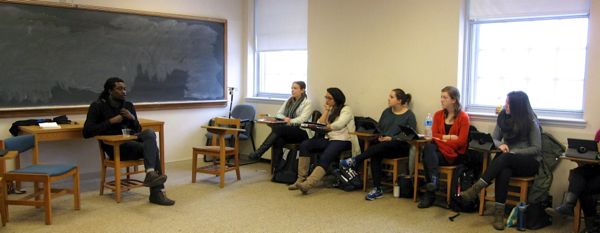 This is a photo of Makenzy Orcel leading a discussion in a French class.