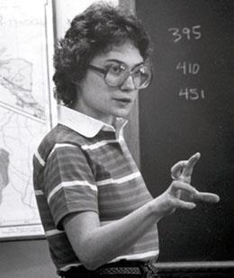 Mary Elizabeth Moser teaching at chalkboard.