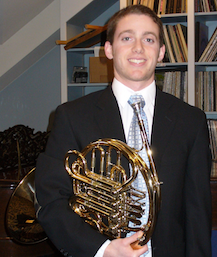 Photo of the Dickinson College horn performance student Matthew Orwtiz, seen here with his instrument.