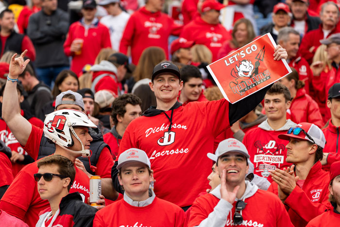 fans cheer at a lacrosse game