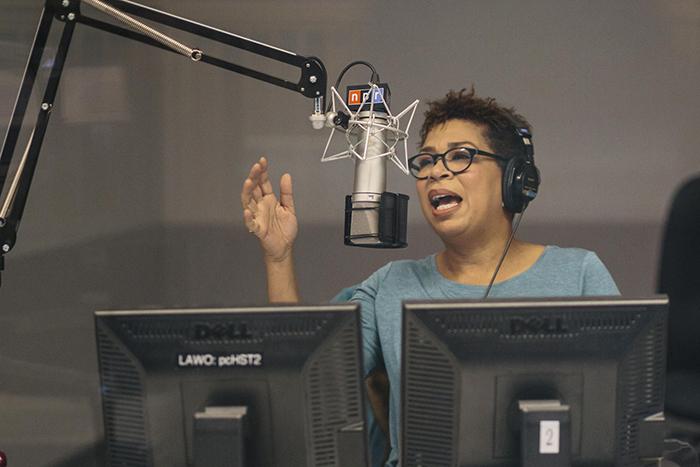 Photo of Michel Martin speaking into a microphone in a studio at NPR headquarters in Washington, D.C.