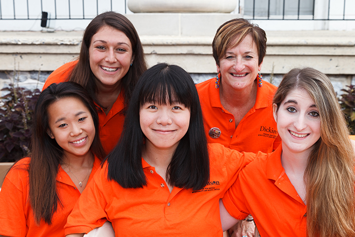 CSSS representatives spread the word during Orientation. According to CSSS Director Donna Hughes (top right), the center’s logo is orange because it is a warm, inviting color that inspires optimism and open communication.