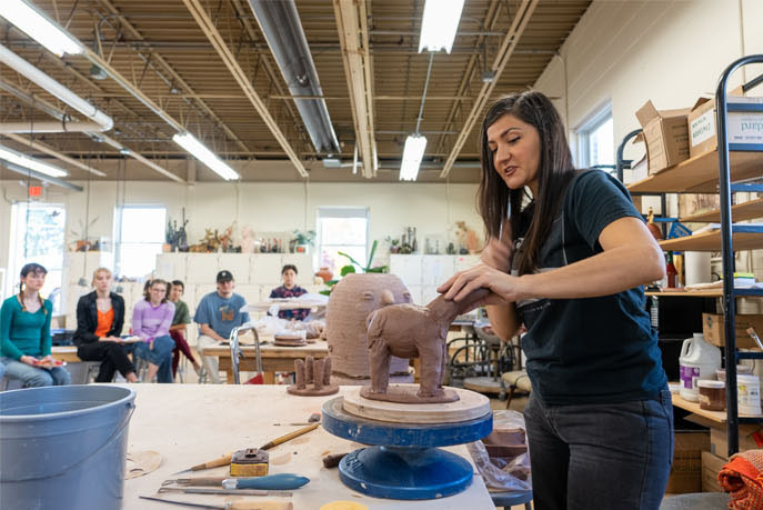 Artist Natalia Arbelaez leads a clay demonstration in the Goodyear Gallery. Photo by Dan Loh.