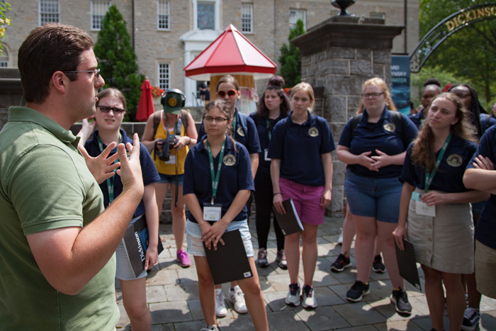 Cooper Wingert gives history academy students a tour of campus