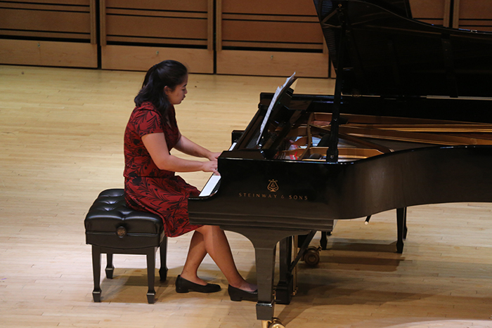 student musician performing at the piano