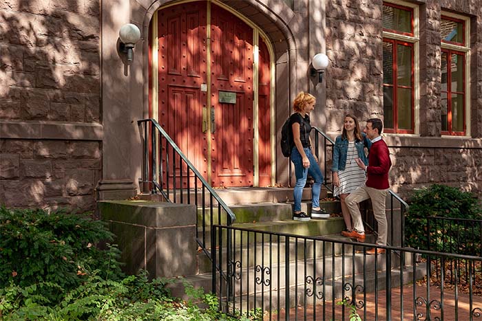 Professor Oconnell with students outside Denny Hall