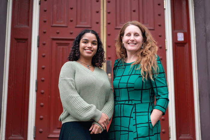 Heather Bedi and a student pose together