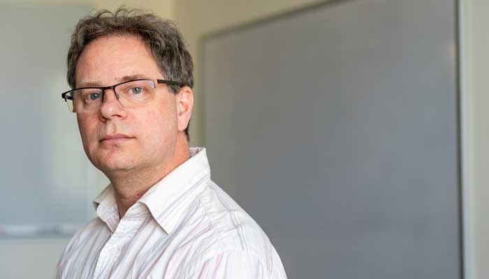 A portrait of Professor of Computer Science John MacCormick