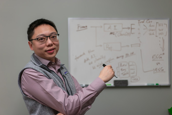 mengnan zhu at a whiteboard