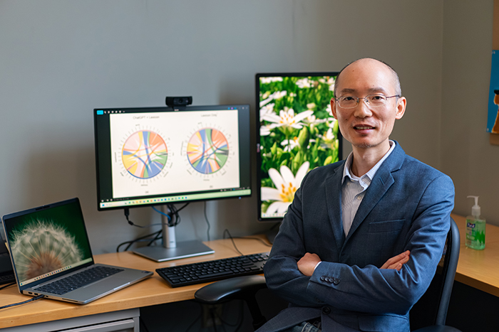 Xialou Wang used an innovative method to analyze the emotional tone of the lyrics in more than 200,000 Chinese-language pop songs. His findings challenge what we think we know about pop lyrics and national mood. Photo by Dan Loh.