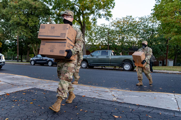 Cadets carry PPE supplies