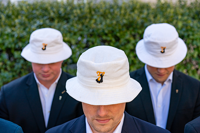 Class of 2023 Raven's Claw members in their emblematic white hats. Photo by Dan Loh.
