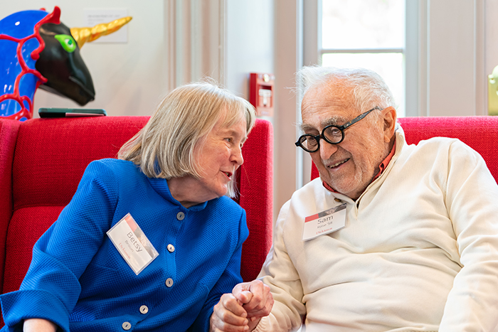 Betsy Broun, director emerita of the Smithsonian American Art Museum (left), chats with Sam Rose '58 during an on-campus celebration in Rose's honor. Photo by Dan Loh.