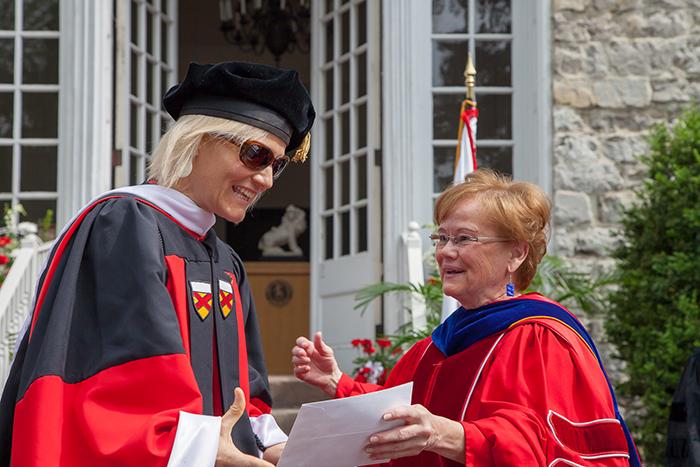 Claire Seiler receives the Ganoe Award from President Margee Ensign.