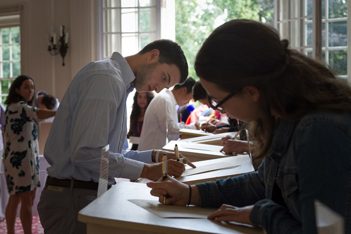 Members of the class of 2021 officially sign in to the college.