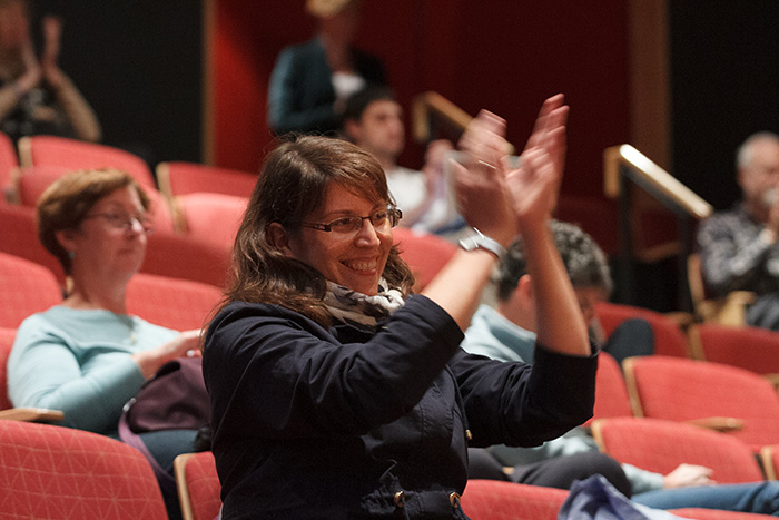Soprano Claudia Reinhard of Singer Pur applauds a student performance during a vocal masterclass. Photo by Carl Socolow '77.