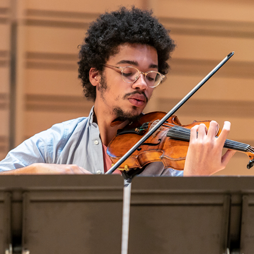 Student playing a musical instrument