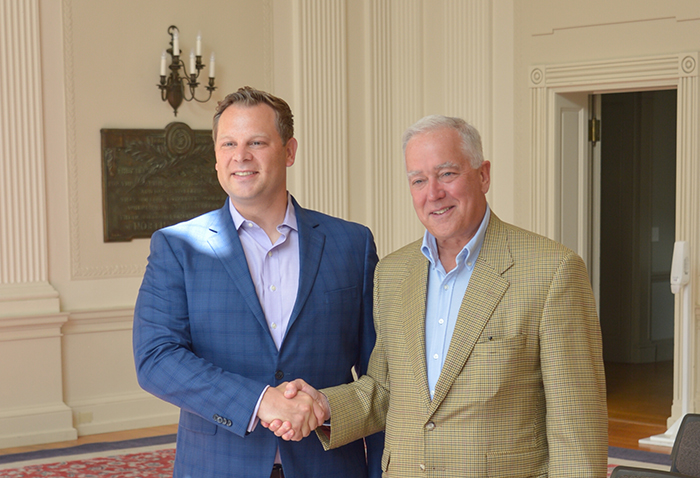 Interim President John E. Jones '77, P'11 (right) thanks Rob Steele '02, a first-generation college student who established a scholarship to help pave the way to Dickinson for first-gens. Photo by A. Pierce Bounds '71.