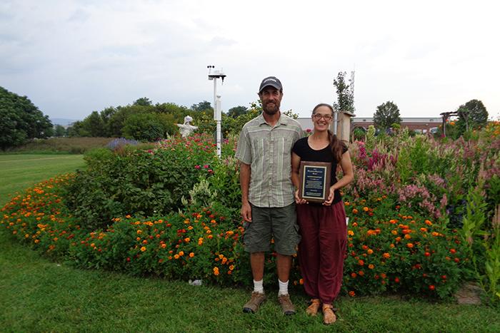 Matt Steiman and Jenn Halpin receive award plaque