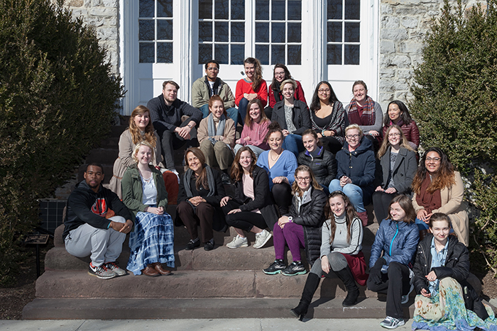 Naomi Shahib Nye poses with students in front of Old West, reenacting a 1959 photo shoot with Robert Frost. Photo by Carl Socolow '77. 