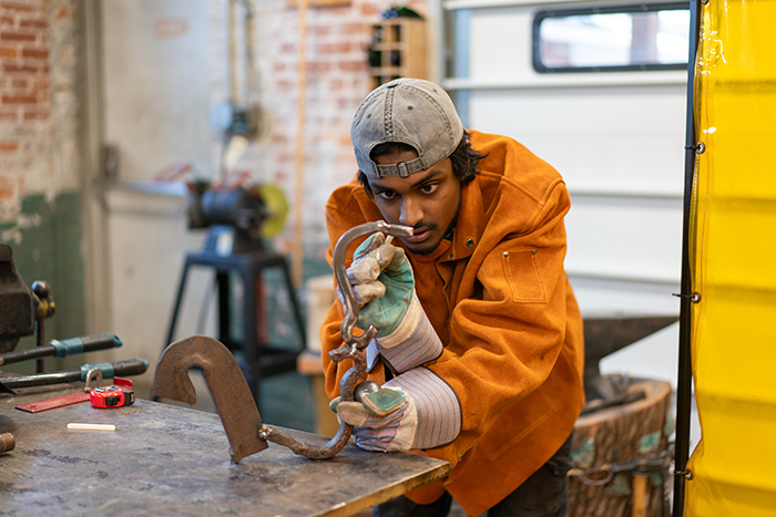 Students get ready for the senior studio-art majors midyear works-in-progress exhibition.