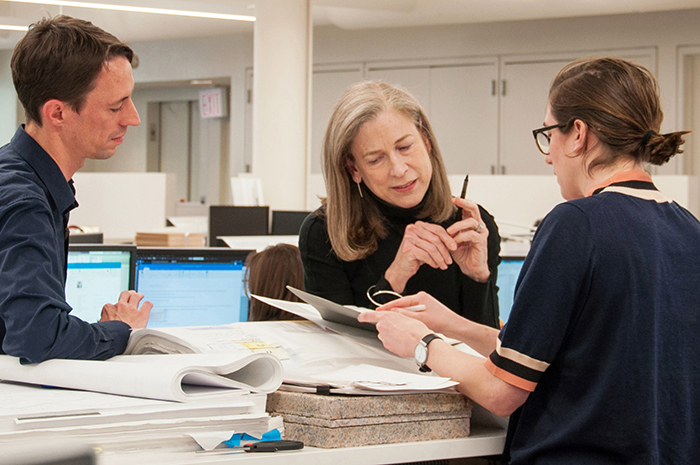 Sylvia Smith '73 (center) at work. Smith, an art-department alumna and Dickinson trustee, is highlighted in the 2022 publication "The Women Who Changed Architecture."