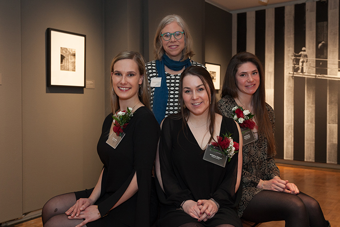 Senior art-history majors (front row, from left) Kate Marra, Monica Skelly and Jacqueline Hochheiser, with Associate Professor of Art History Elizabeth Lee (back row) on the exhibition's opening night.