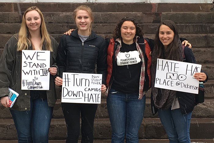 Dickinson Students holding signs