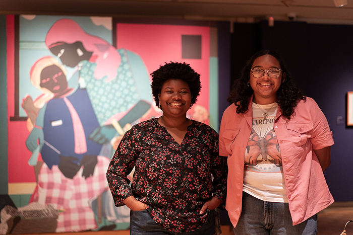 Trout Gallery interns Ella Layton '26 (left) and Kiersten Kahn ‘26 are helping to plan and present special events to share the exhibition with the campus and local communities.  Photo by Dan Loh.